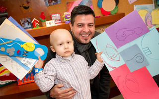 Luis Enrique with a St. Jude patient