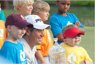 St. Jude patient Ethan with PGA golfer Loren Roberts.