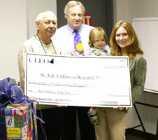 Pictured at the Jan. 6 Cleo check presentation were (from left) Pat Smith, the company's honorary check presenter; Cleo President Andy Kelly; St. Jude patient Abbi and her mother, Jodi.