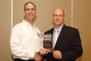 Clark Sweat, senior vice president of Corporate Alliances, accepts the 2008 Halo Award