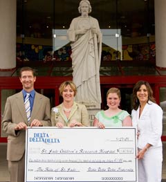 St. Jude patient Beverly Hannaford (center right) was on hand to receive a check for $1.3 million to endow St. Jude Children's Research Hospital's Teen Room. The check was presented by Tri Delta National President Michelle Shimberg (center left).