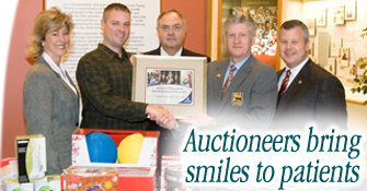 Auctioneers came to St. Jude to conduct the annual toy auction.