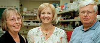 Ginny Frattinger, Elaine Tuomanen, MD, and Tom Frattinger tour the Children's Infectious Defense Center.