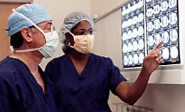 Surgery doctors viewing MRIs