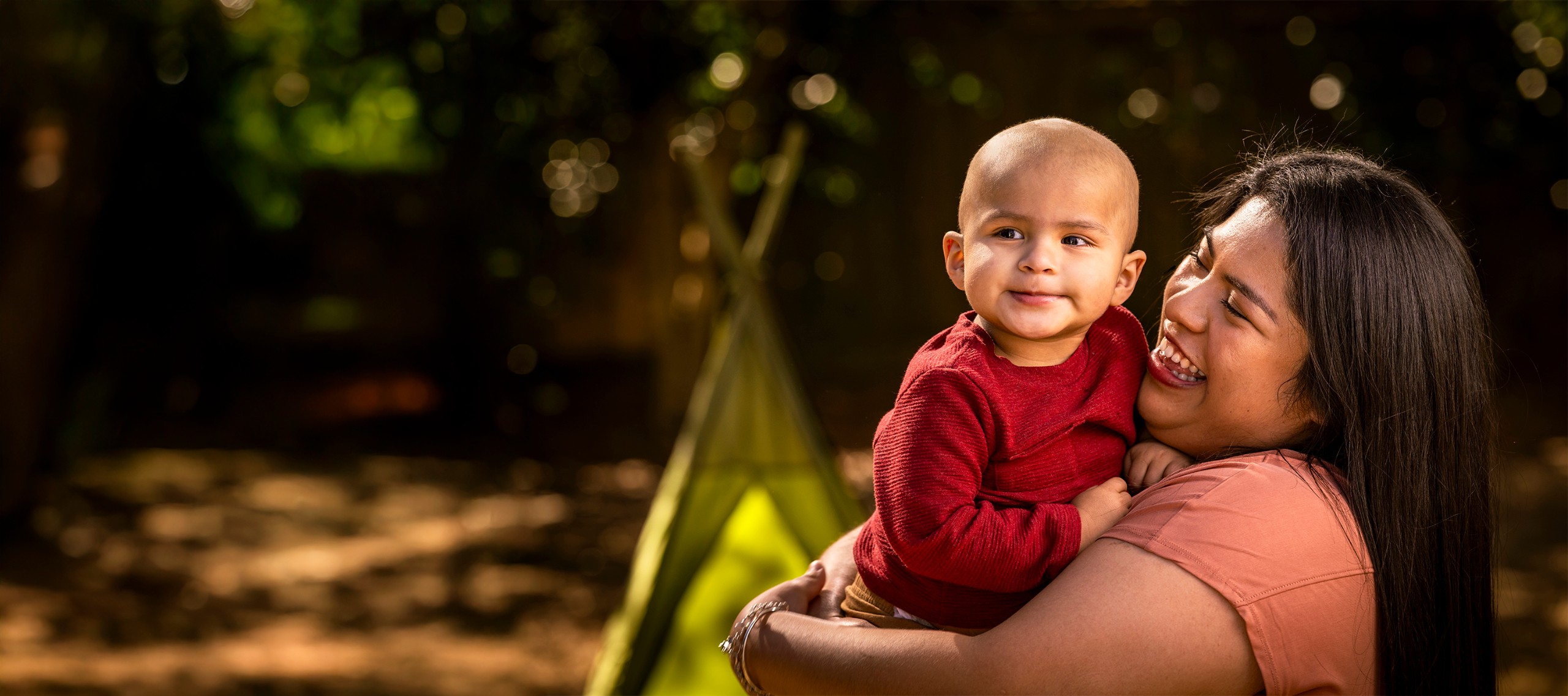 St. Jude patient Mateo is held by his mom.