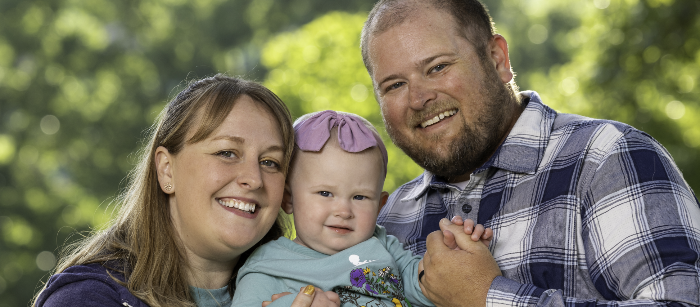 St. Jude patient Rylee with her mom and dad.
