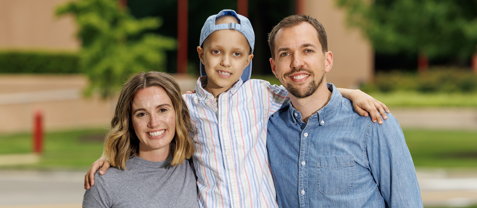 St. Jude patient Reid with his mom and dad.