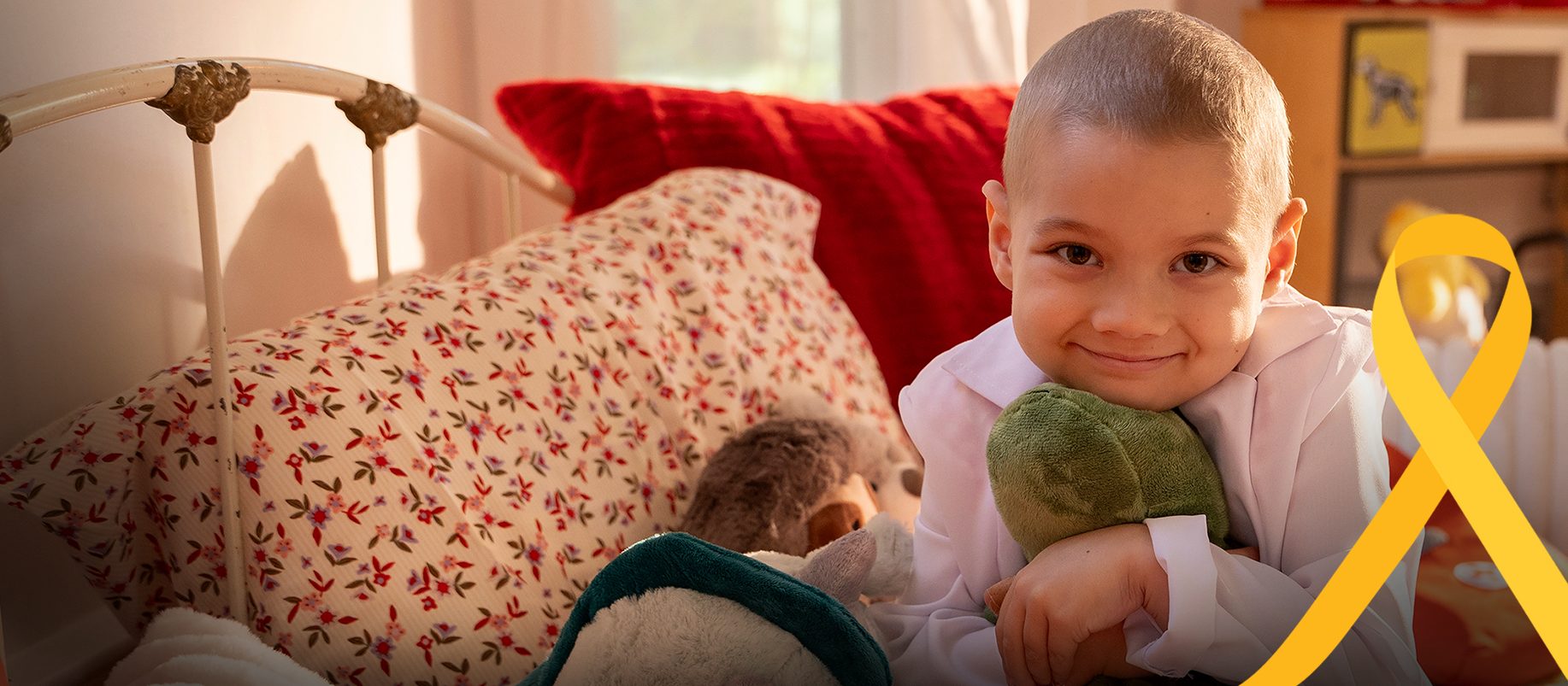 St. Jude patient Erma hugging her stuffed animals