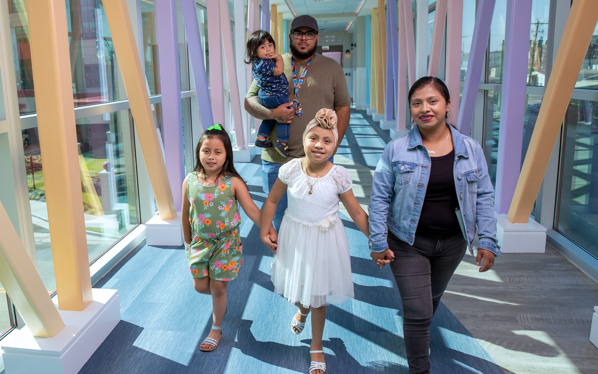 St. Jude patient Liliana and family walk down the halls of St. Jude