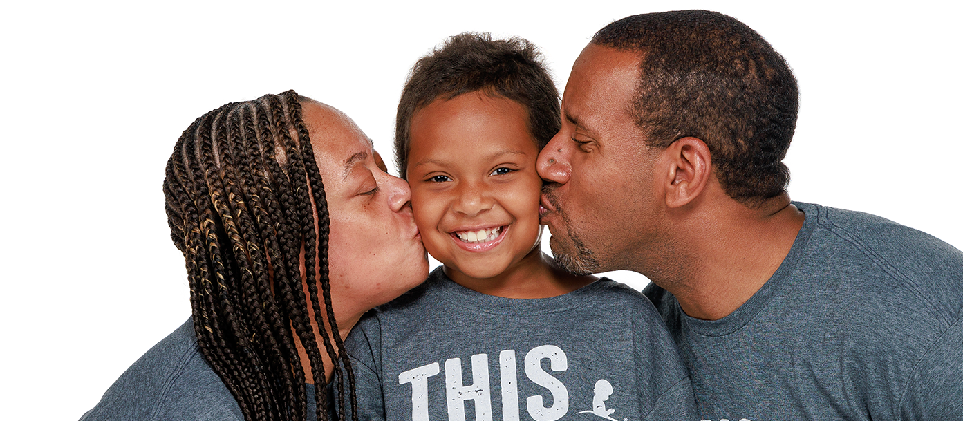 St. Jude patient Kinsley and family St. Jude patient Kinsley and her parents wear a This Shirt Saves Lives T-shirt