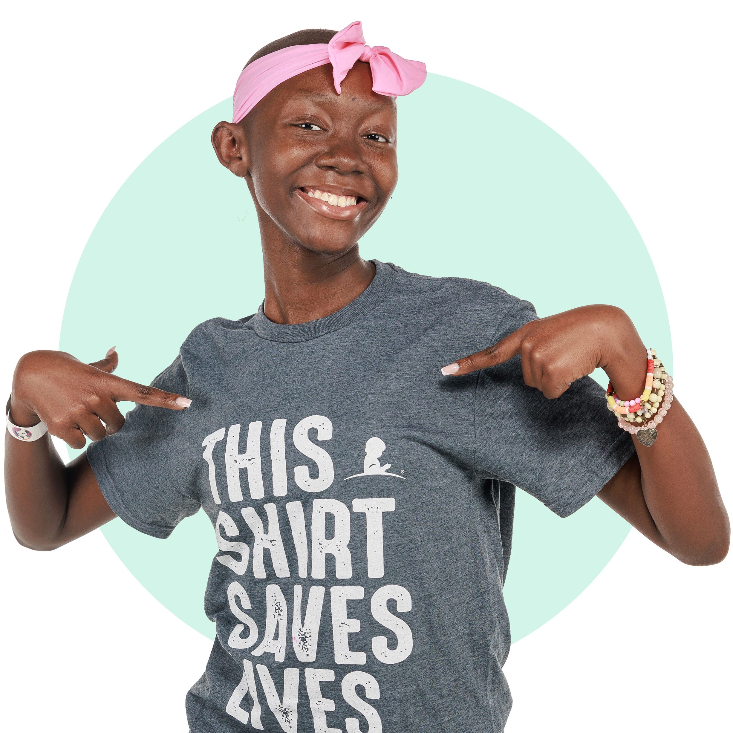 St.Jude patient Gabrielle wearing a "This Shirt Saves Lives" T-shirt