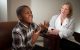 Kim Nichols, MD, with patient