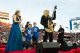 Miss AutoZone Liberty Bowl on stage with St. Jude patients Caleb and Tyler.