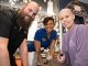 St. Jude patient Kennan and Best Buy employee pose for a picture.