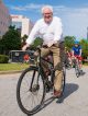 John Curran, Design and Construction director, pedals around the campus’ IRC circle.