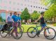 People walking their bikes.