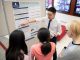 Anthony Liu shows his poster.