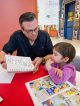 Bill Morrison, who draws “The Simpsons” and “Futurama,” with St. Jude patient Sofia.