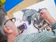 Caricaturist Dave Washburn adds detail to his dog cartoon.