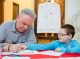 Steve McGarry, whose work includes  “Biographic” and “KidTown,” with St. Jude patient Tyler.