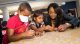 Catherine Brewton with a St. Jude patient and sibling.
