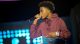 Kyle Randolph sings on stage.