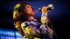 Erica Campbell sings into the microphone.