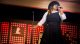  Jazmine Sullivan sings on stage.