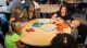 Jasmine Sullivan playing games with St. Jude patients and guests.