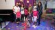 Anita Wilson, Jawn Murray, Erica Campbell, Travis Greene, and Catherine Brewton pose with St. Jude patients and family.
