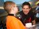 St. Jude patient Gavyn with Carnival Cruise Director Tyler Ryan.