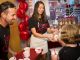 Carnival staff share cookies with St. Jude patient Victoria.