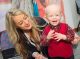 Young St. Jude patient with smiling woman