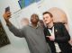 Teenager taking a selfie with a celebrity