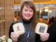 Dana Bottenfield, vice president of Human Resources, distributes cookies to employees to mark the occasion.