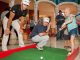 Patient putting with professional golfers