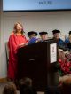 A woman speaks at the podium.