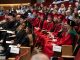 The graduating students sit in the audience.