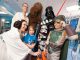 Star Wars group handing out candy to a child.