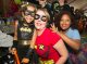 Child dressed as Batman and woman dressed as Robin.