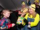 A trick-or-treater visits the Minions booth.