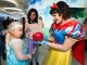 Snow White shows the poisoned apple to Elsa from Frozen.