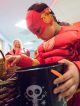 Flash gets candy out of a bucket.