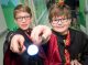 Patients dressed in Harry Potter costumes point their wands at the camera.