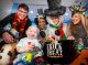 St. Jude patient Grayson smiles with a Harry Potter, two snowmen, and a deer.