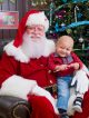 Santa Claus shares a smile with Alberto during a special event for patients and siblings.