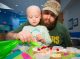 St. Jude patient and parent making a gingerbread man