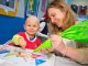 St. Jude patient and parent making a gingerbread man