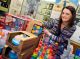 Woman posing in front of toys