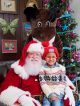 Ian and Santa Claus pose for a holiday photo.